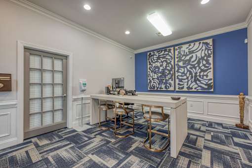 A room with a table and chairs in it.