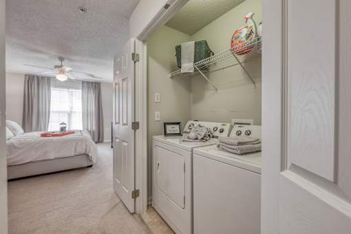 A laundry room with a washer and dryer in a home.