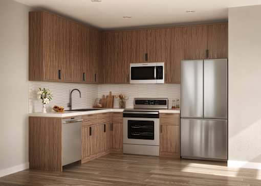 A modern kitchen with wooden cabinets and stainless steel appliances.
