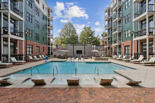 1 Bedroom Apartments in Germantown Nashville TN - Peyton Stakes - Sparkling Pool with Lounge Seating, Sundeck, TV, and Spa.