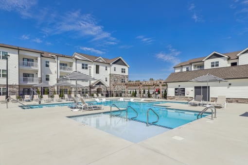 our apartments offer a swimming pool with chairs and umbrellas