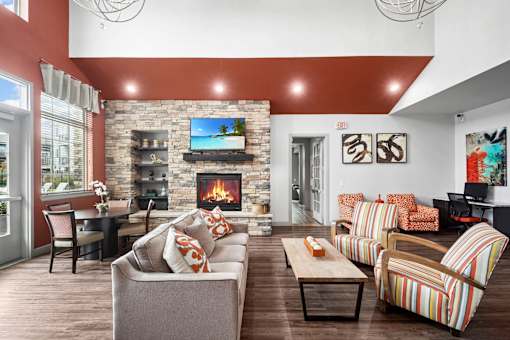 A living room with a fireplace and a flat screen TV.