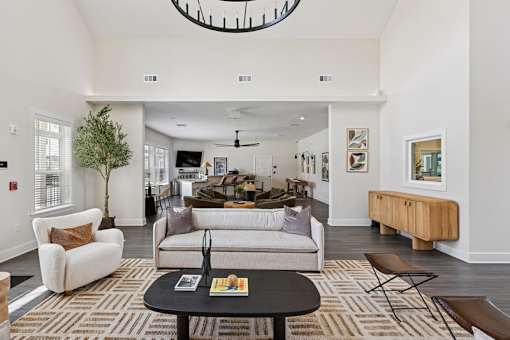 A clubhouse with a white couch and a black coffee table.