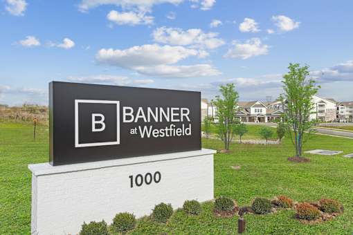 A sign for Banner at Westfield with a large B on it.