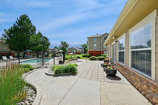 A residential area with a pool and a fence.