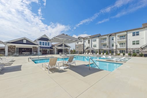 our apartments have a pool and lounge areas with chairs