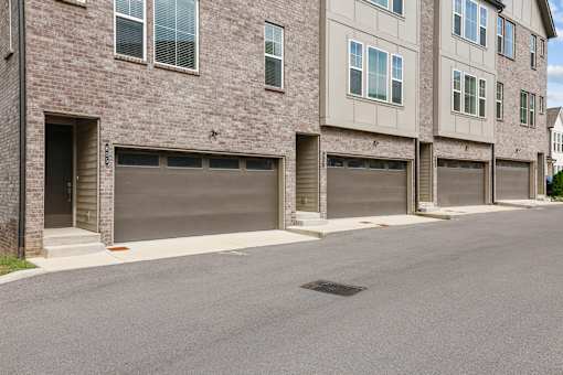 A row of garage doors on a street.
