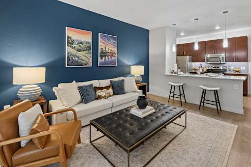 A living room with a brown leather chair and a black coffee table.