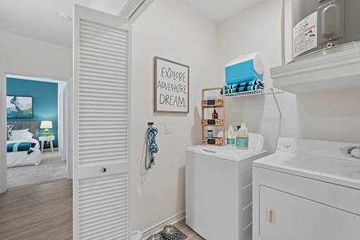 A bathroom with a white cabinet and a sign that says "Explore Adventure Dream".