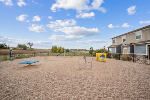 A playground with a blue table and a yellow square.