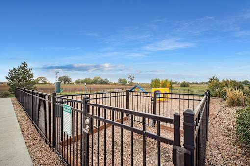A black fence with a sign on it.