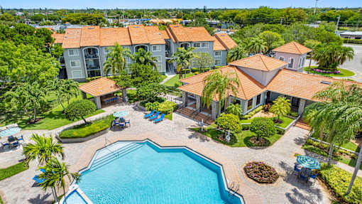 A large house with a pool in the backyard.