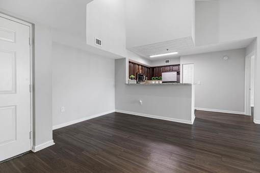 A kitchen area with a countertop and cabinets.