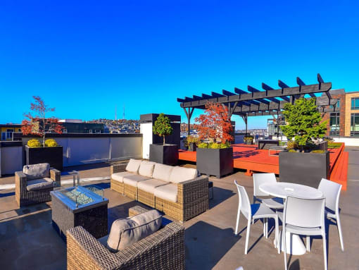 Luxury Apartments for Rent in Seattle, WA- Union Bay- Rooftop Lounge Multiple Seating Areas with City View and Landscaping
