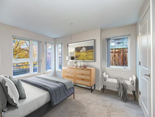 a bedroom with a bed and a dresser