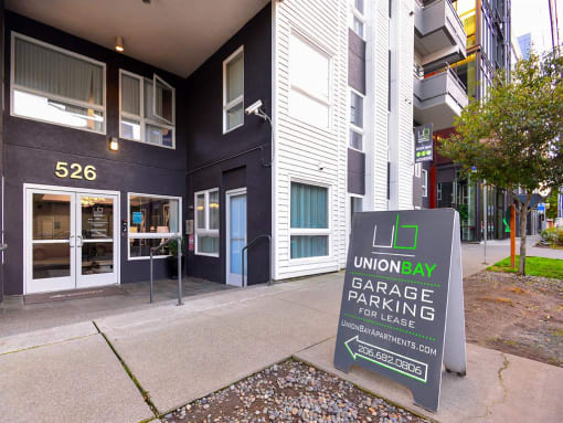 a sign in front of a building that says union bay garage parking