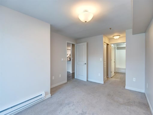 an empty room with a carpeted floor
