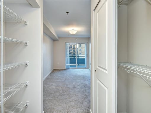 a walk in closet in a 555 waverly unit