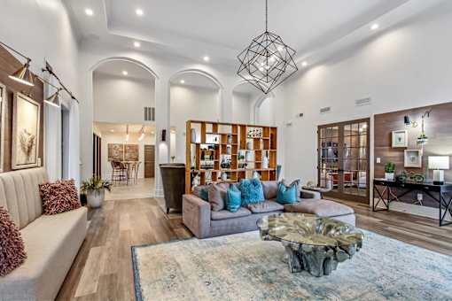 A modern living room with a large sofa and a coffee table.