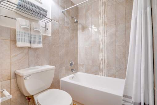 bathroom with tub and tile surround