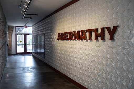 A hallway with a wall that has the word