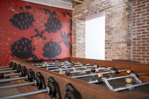 A row of xylophones are lined up on a stand.