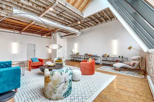 A living room with a mix of modern and vintage furniture.