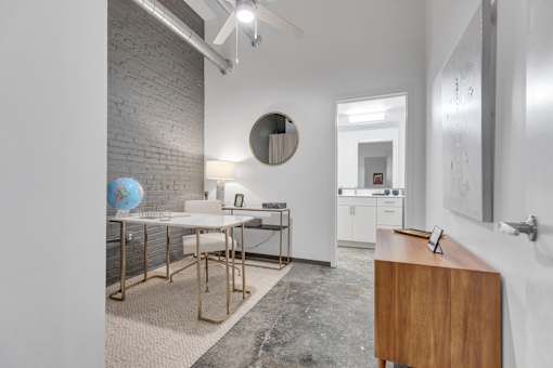A room with a white table and a globe on it.