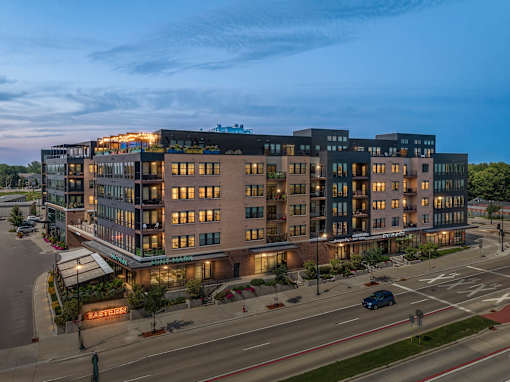 A large, modern building with a lot of windows and a sign that says "East Street.".