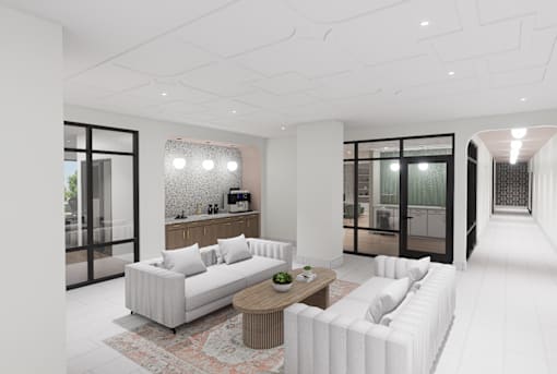 A modern living room with a white sofa and a wooden coffee table.