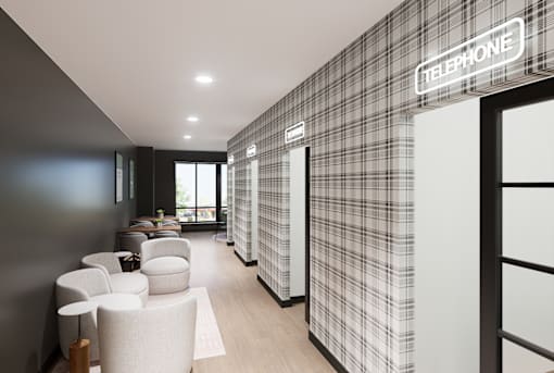 A modern office with a telephone sign on the wall.