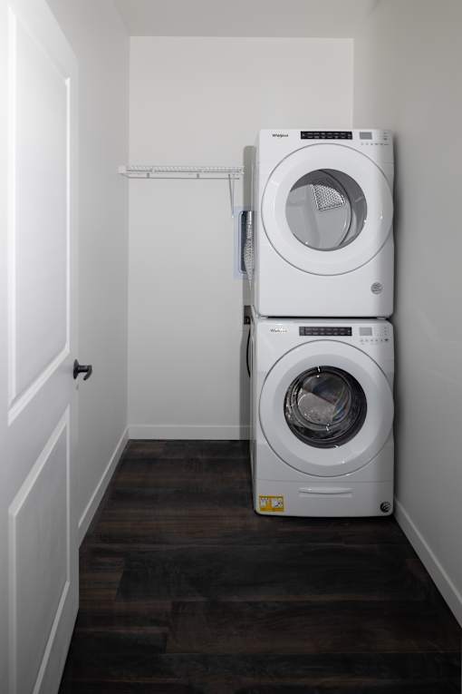 Stacked washer and dryer in laundry closet at The Avery - Residential Apartments, Fargo, ND