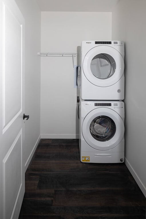a washer and dryer in a small laundry room at The Landing at 1001 NP, Fargo, ND 58102
