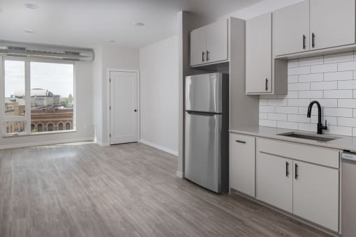 Kitchen with cabinets at Kesler Apartments in Downtown Fargo, Fargo, North Dakota 58102