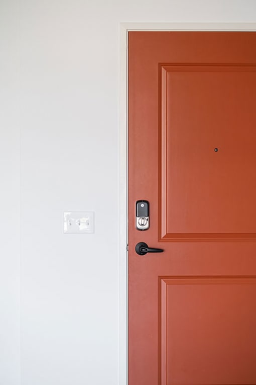 a red door with a white door next to it at The Landing at 1001 NP, Fargo, North Dakota 58102