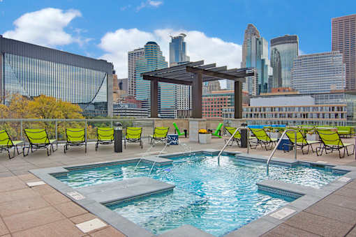 A pool with a view of the city skyline.