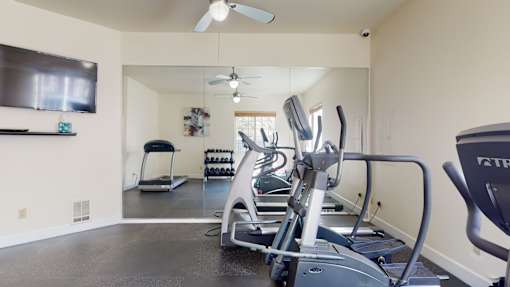 A fitness center here at Windsong featuring cardio machines, free weights, and a full wall mirror. Bright and motivating, this well-equipped space offers a convenient area for energizing workouts.