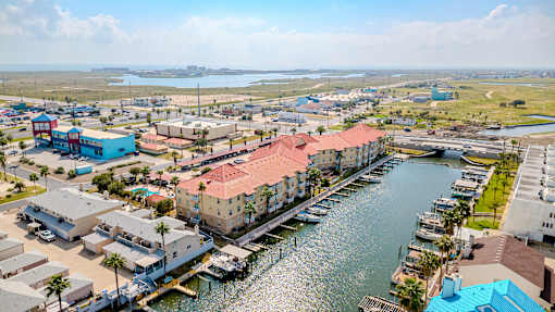 A view of a marina with boats docked in the water.