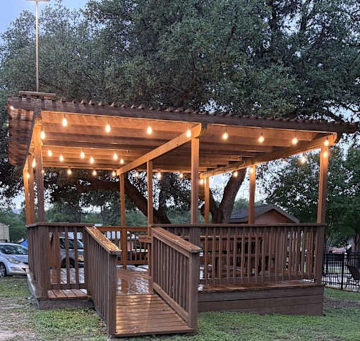 Shaded community gazebo with seating at Sierra Ranch Apartments in San Antonio, TX.