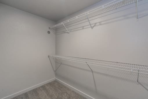 Large walk-in closet with built-in shelving at Reserve on Abrams Dallas