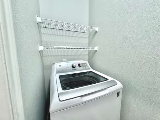 A white oven with a rack on top of it.