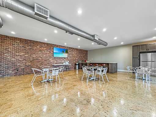 Clubhouse interior with seating area and bright lighting