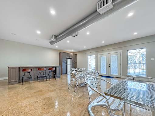 Clubhouse seating area with modern décor and polished flooring