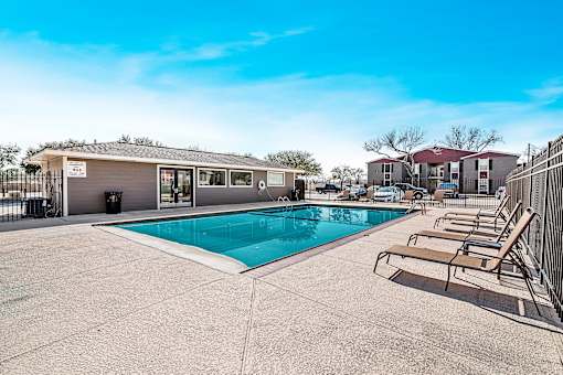 Poolside view of Sage Creek Apartments community in Victoria TX