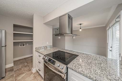 Kitchen breakfast bar with granite countertops