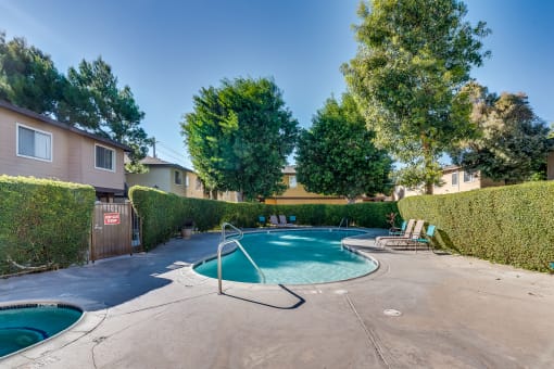 take a dip in the hot tub at villas at houston levee west apartments in