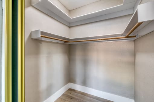 a room with white walls and a wooden floor