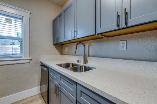 a kitchen with a sink and a window