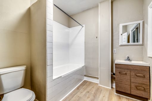 a bathroom with a bathtub and a sink