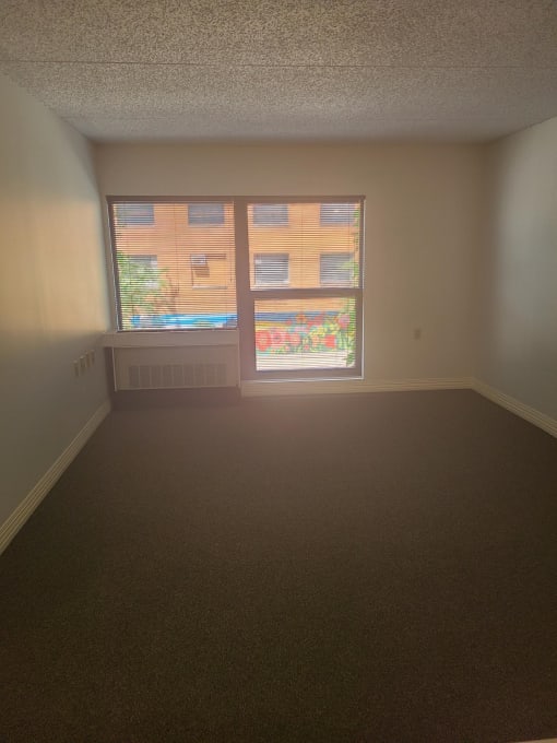 an empty room with a large window